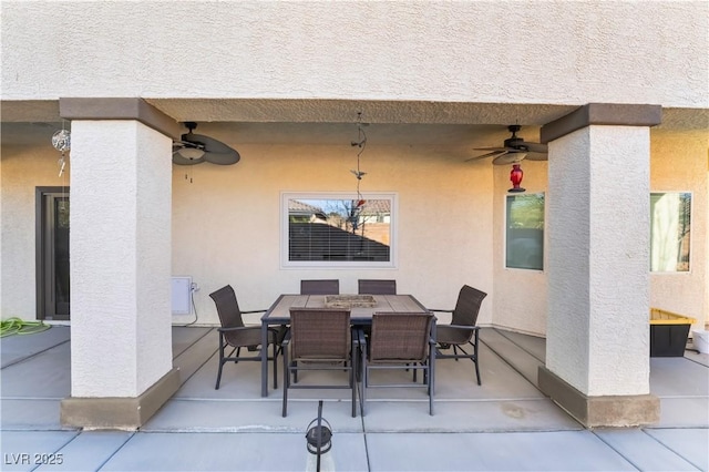 view of patio / terrace with a ceiling fan and outdoor dining space