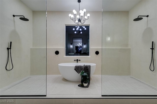 bathroom featuring a freestanding tub and walk in shower