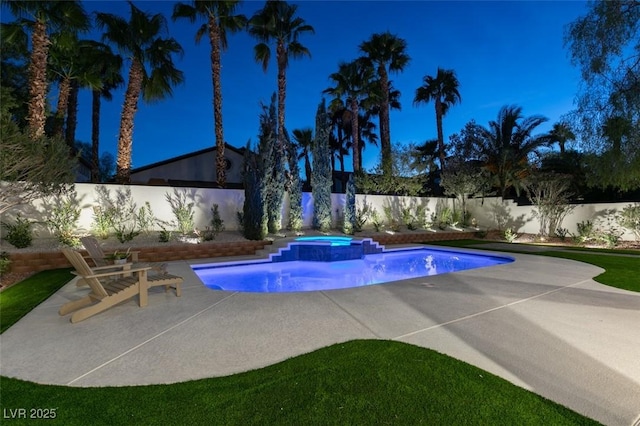 view of pool with a fenced backyard, a pool with connected hot tub, and a patio