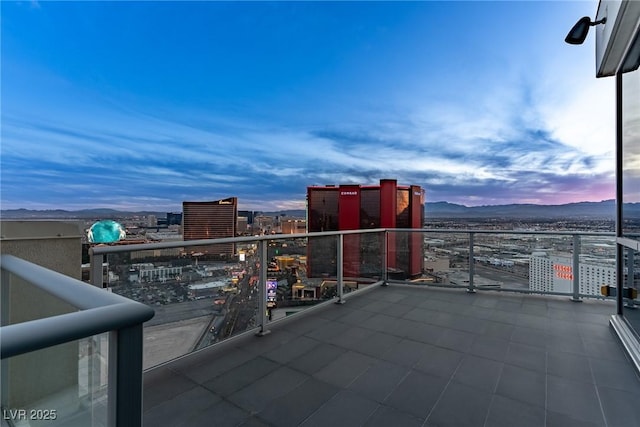 balcony with a view of city and a mountain view