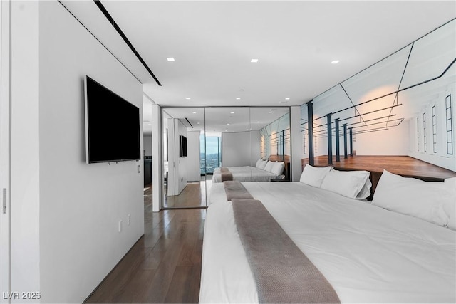 bedroom featuring recessed lighting and wood finished floors