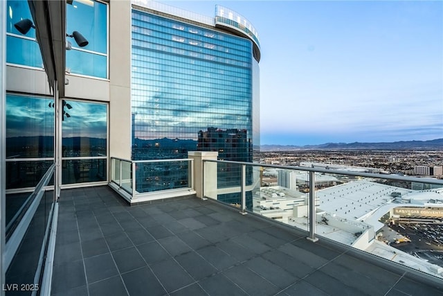 balcony with a city view and a mountain view