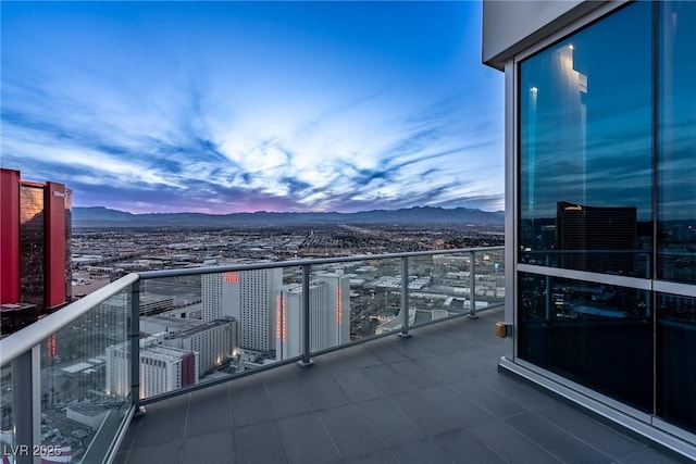 balcony featuring a view of city and a mountain view