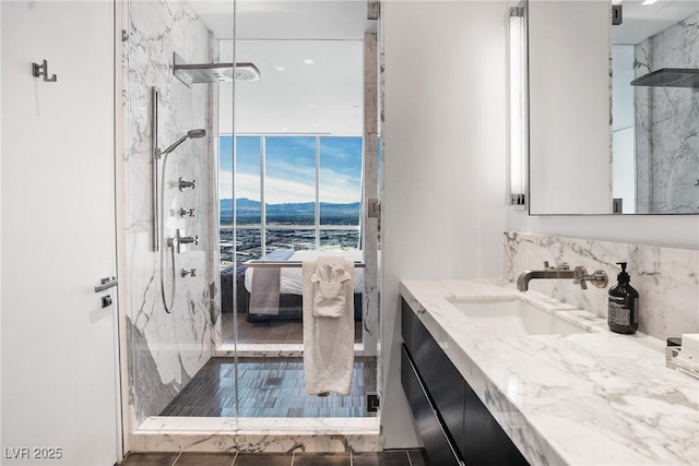 bathroom featuring ensuite bath, a marble finish shower, backsplash, and vanity