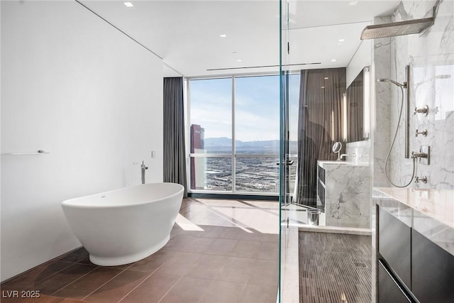 bathroom featuring a soaking tub, a marble finish shower, and floor to ceiling windows