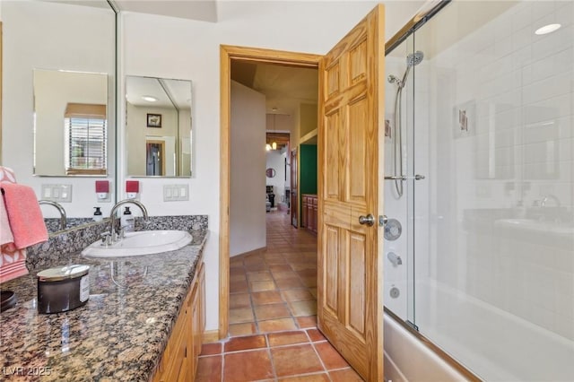 full bath featuring enclosed tub / shower combo, vanity, and tile patterned floors