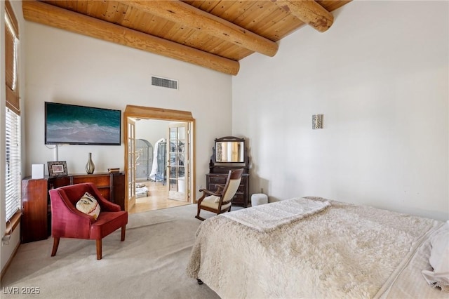 bedroom featuring carpet floors, visible vents, a high ceiling, wooden ceiling, and beamed ceiling