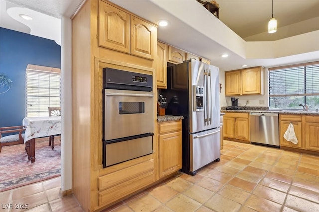 kitchen with plenty of natural light, appliances with stainless steel finishes, a warming drawer, and recessed lighting