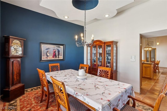 dining area featuring a chandelier, light tile patterned floors, and recessed lighting