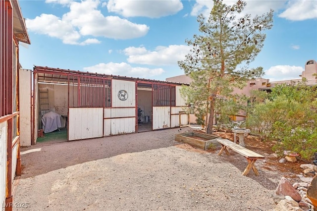 view of yard with an outbuilding and an exterior structure