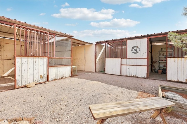 view of yard featuring an outbuilding and an exterior structure