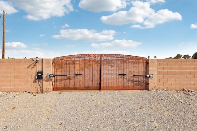 view of gate featuring fence