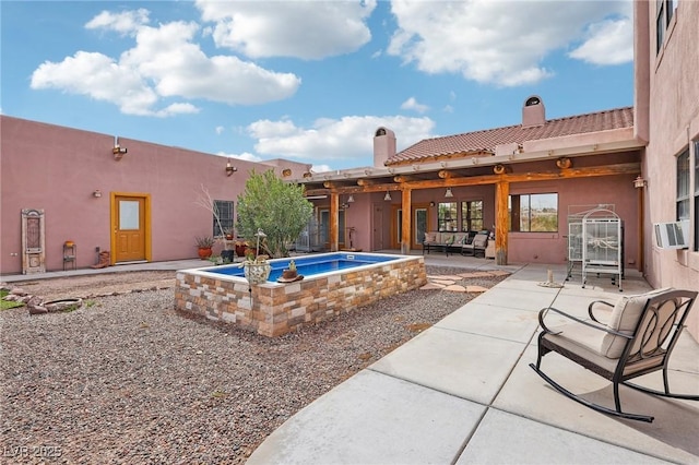 view of swimming pool with cooling unit and a patio