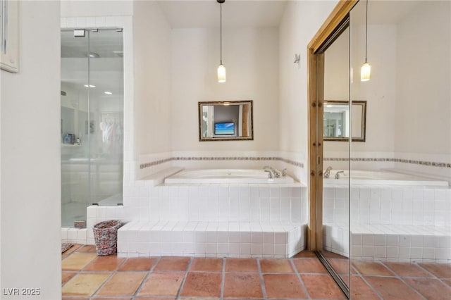 full bathroom with a stall shower and a garden tub