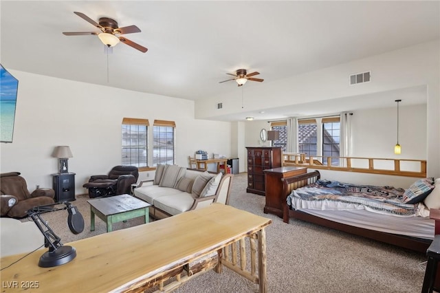 bedroom with carpet floors, multiple windows, and visible vents