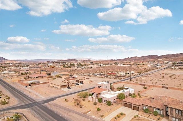 bird's eye view with a mountain view and view of desert