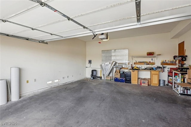 garage featuring a workshop area and a garage door opener