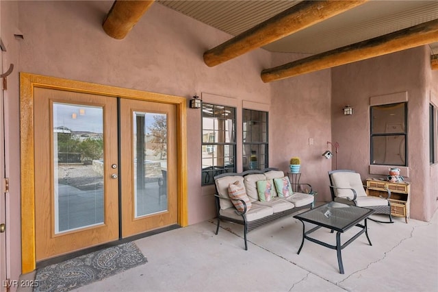 view of patio featuring an outdoor living space and french doors