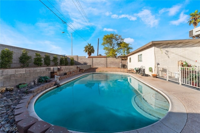 view of swimming pool featuring a fenced backyard and a fenced in pool