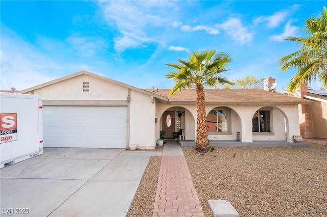 ranch-style home with an attached garage, driveway, a porch, and stucco siding