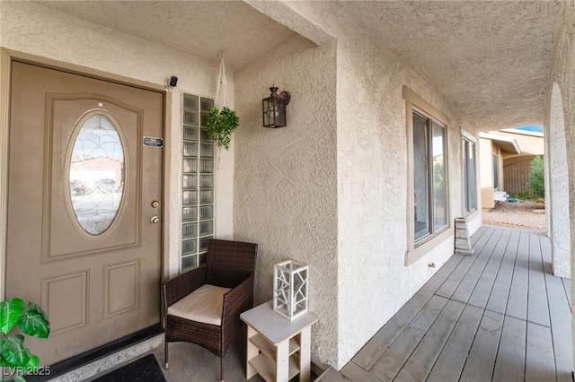 property entrance featuring stucco siding