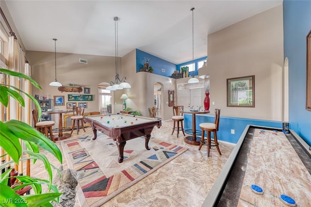 playroom featuring arched walkways, visible vents, a high ceiling, billiards, and baseboards