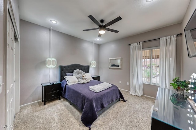 bedroom featuring ceiling fan, baseboards, and carpet flooring