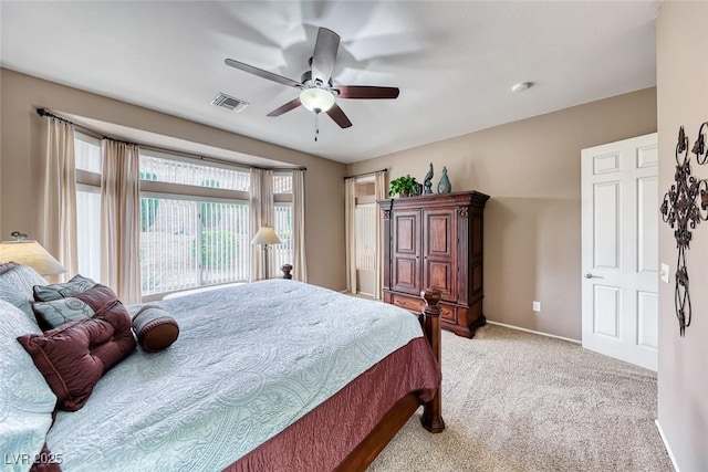 bedroom with ceiling fan, light colored carpet, visible vents, baseboards, and access to outside