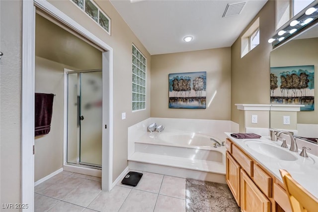 bathroom with a garden tub, visible vents, a shower stall, vanity, and tile patterned flooring