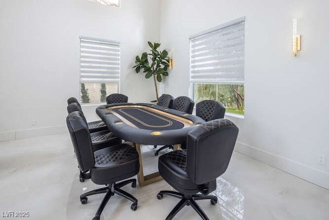 office with concrete floors and baseboards