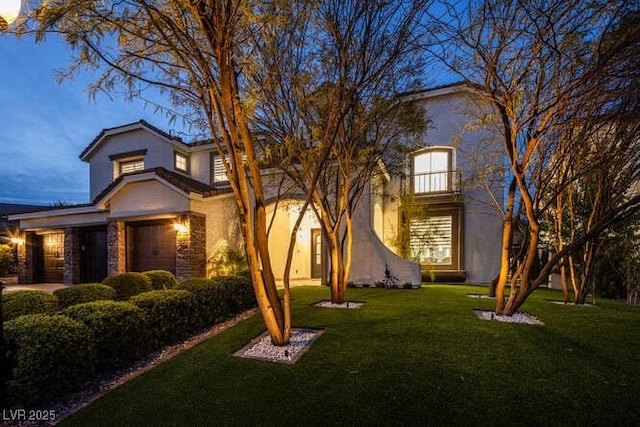 view of front of property featuring a front yard and stucco siding