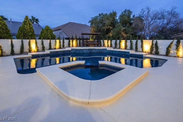 view of swimming pool featuring a fenced in pool, a fenced backyard, and an in ground hot tub