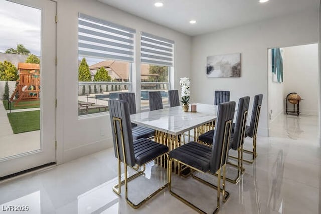 dining area with baseboards and recessed lighting