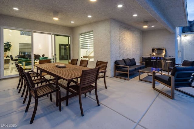 dining room with a textured ceiling, concrete floors, and recessed lighting