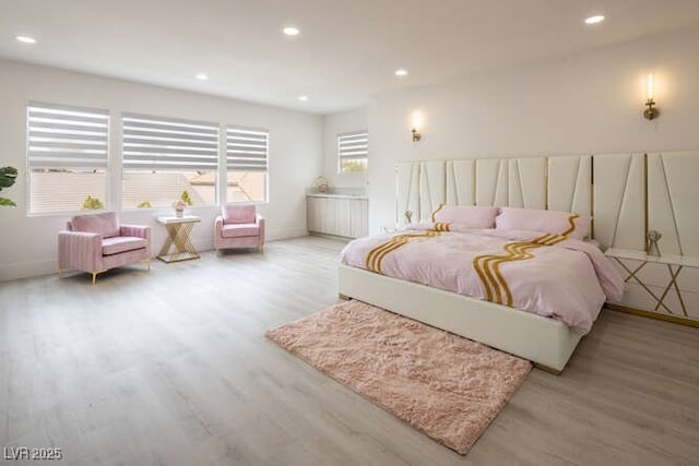 bedroom featuring recessed lighting, baseboards, and wood finished floors