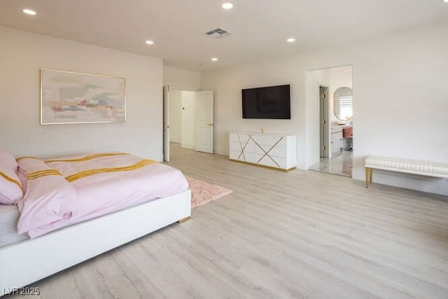 bedroom with light wood-type flooring, visible vents, and recessed lighting