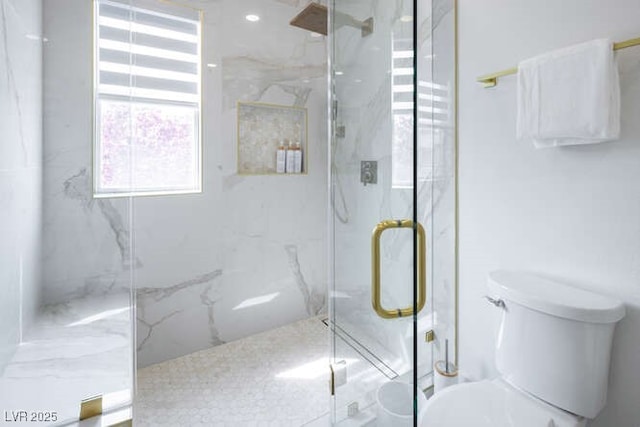 full bath featuring toilet and a marble finish shower