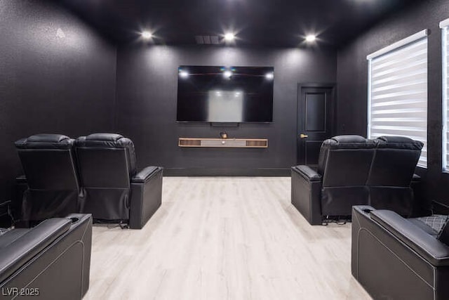 home theater room with recessed lighting and wood finished floors