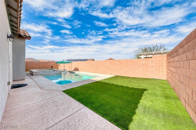 view of pool with a fenced backyard, an in ground hot tub, a lawn, a fenced in pool, and a patio area