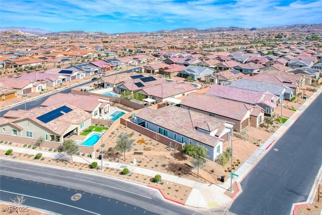 drone / aerial view with a residential view and a mountain view