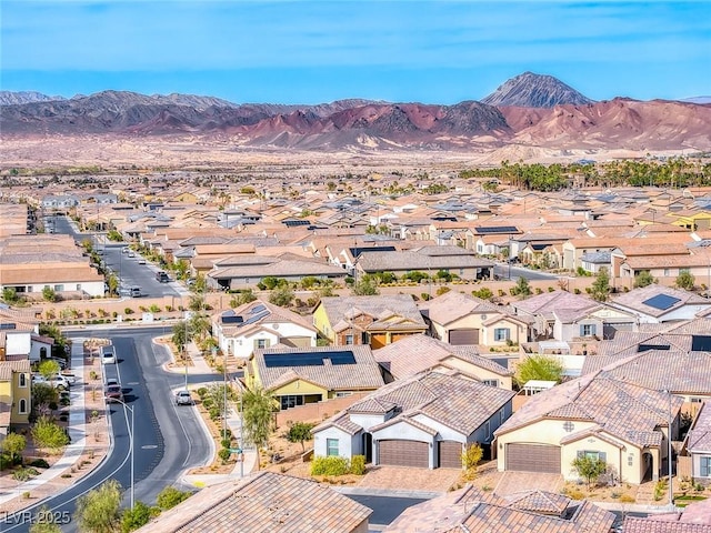 aerial view featuring a mountain view and a residential view