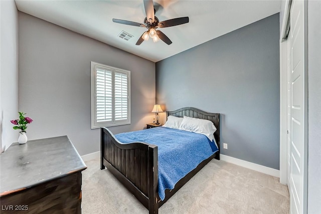 bedroom with carpet floors, baseboards, visible vents, and ceiling fan