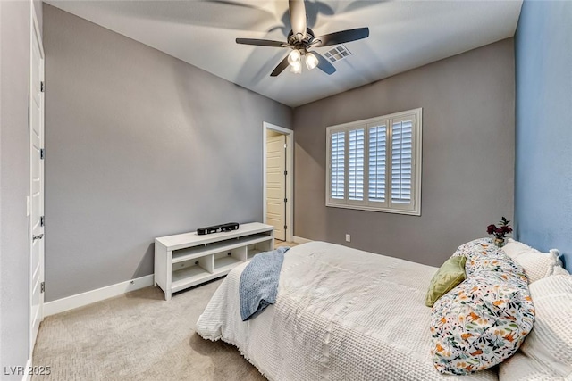 bedroom with ceiling fan, carpet flooring, visible vents, and baseboards