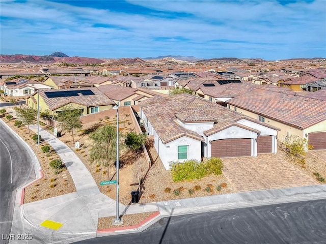 birds eye view of property with a residential view and a mountain view