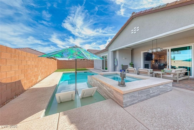 view of swimming pool with a pool with connected hot tub, a fenced backyard, and a patio