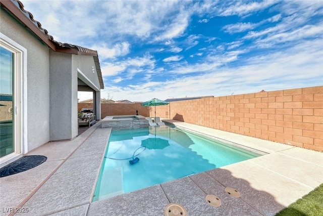 view of pool with a patio, a fenced backyard, and a pool with connected hot tub