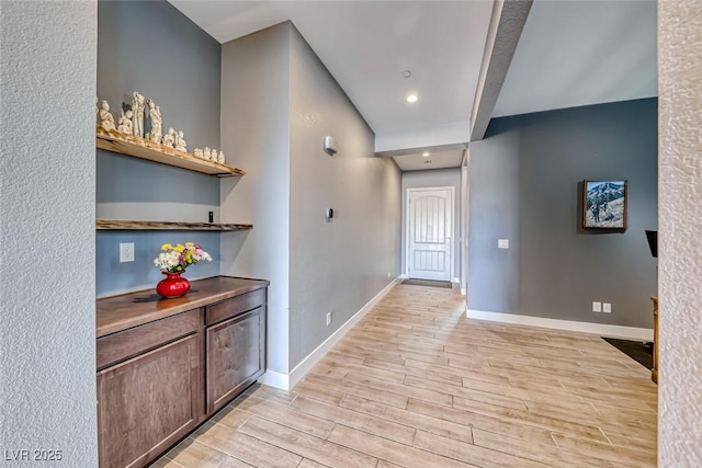 interior space with recessed lighting, baseboards, and wood finish floors