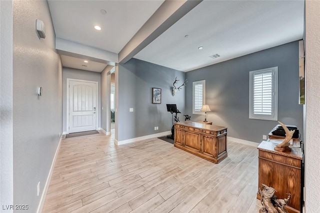 home office featuring light wood finished floors, recessed lighting, visible vents, and baseboards