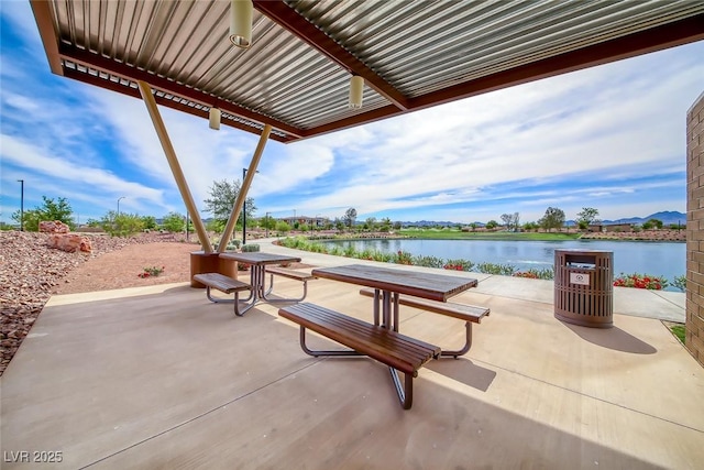 view of patio / terrace with a water view