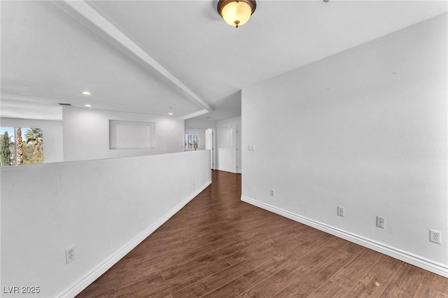 unfurnished room with recessed lighting, wood finished floors, and baseboards